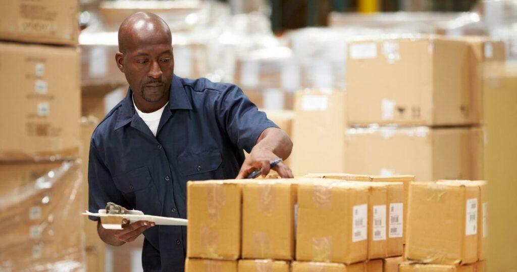 warehouse worker inspecting boxes